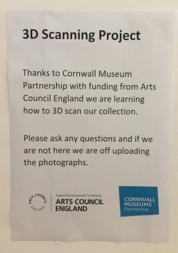 Sign reading "3D scanning project. Thanks to Cornwall Museum Partnership with funding from Arts Council England we are learning how to 3D scan our collection"